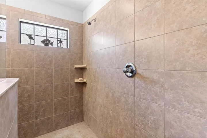Huge primary walk-in shower.