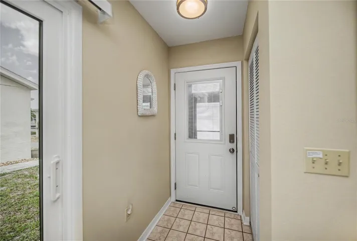 Welcome!  This is the foyer with a coat closet.