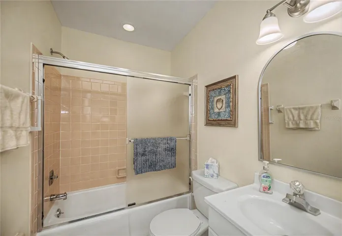 Guest bathroom includes tub and shower.