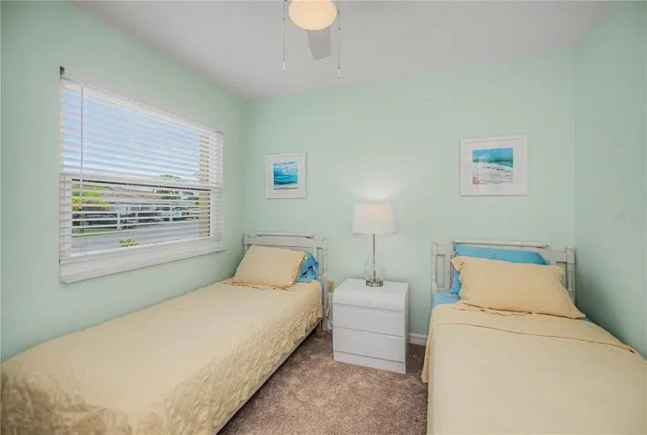 Guest bedroom with twin beds and large window for great natural light.