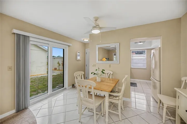 Lots of natural light comes in through the patio doors in dining area.
