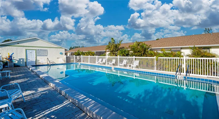 Large community pool with plenty of seating space.