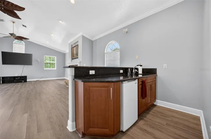 Wetbar in the bonus room with refrigerator
