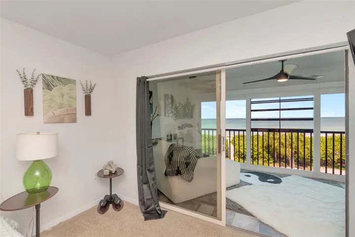 Primary Bedroom with slides out to the enclosed Lanai