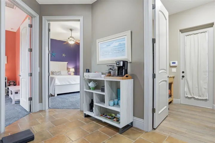 Coffee Bar and Hall to Additional Bedrooms, Bathroom, Laundry, and Garage