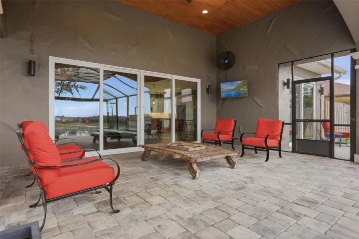 Lanai with mounted television and large fans