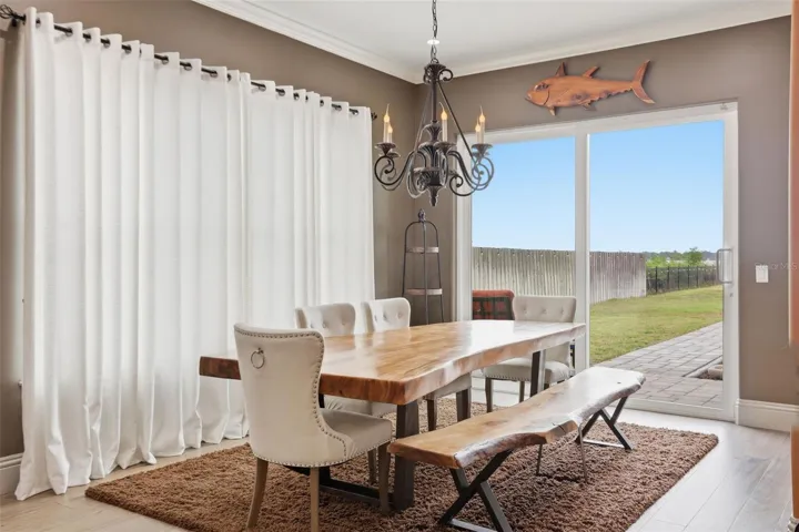 Dining room with sliders to backyard