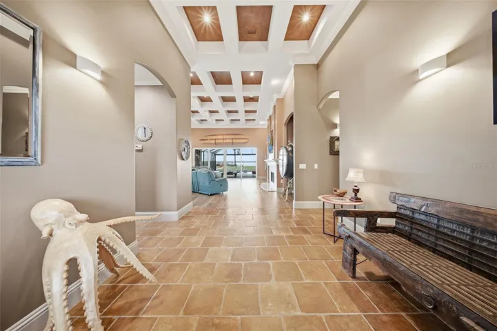 Coffered ceilings make a statement as you enter the foyer