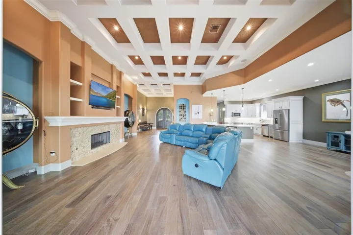 Living room with view into kitchen