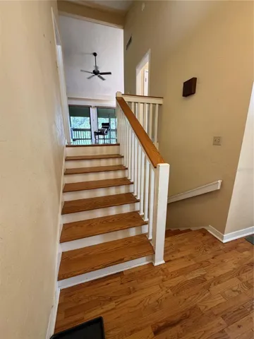 Stairway to living/kitchen/dining area