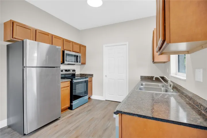 The galley kitchen has all new appliances.