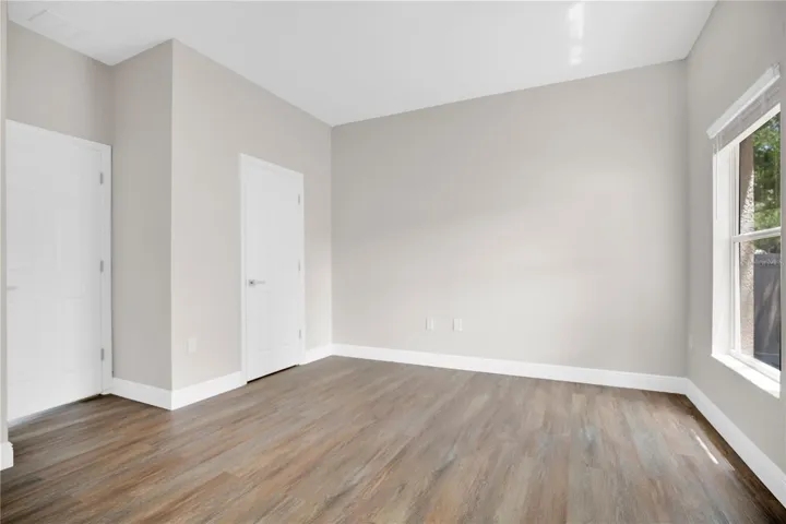 The primary bedroom features private bathroom and walk-in closet