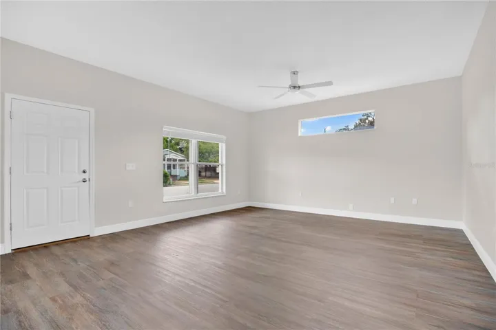 High ceilings and plenty of natural light give the living room a spacious feel.