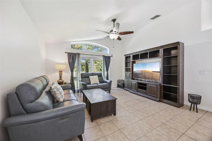 Comfortable Family Room with New double pane insulated sliders to the back Porch.