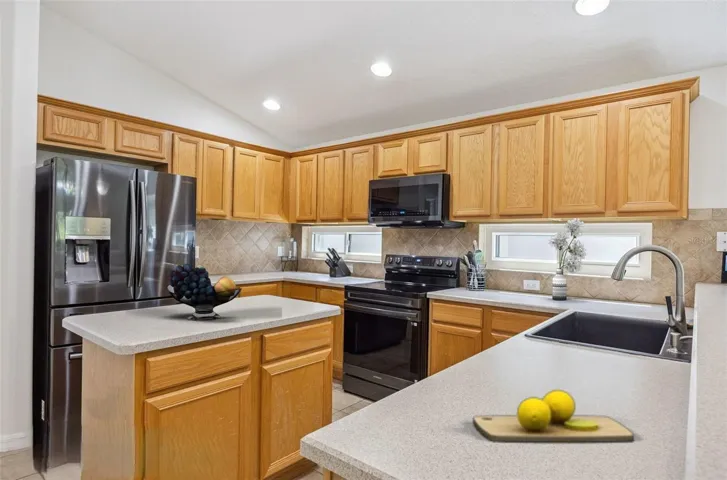 This kitchen features new double pane windows, great prep space with center island and considerable countertops.Virtually Accessorized.