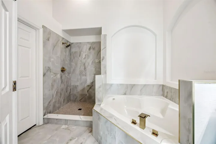 Newly Renovated Bathroom Contemporary Tile, shower door to be installed.