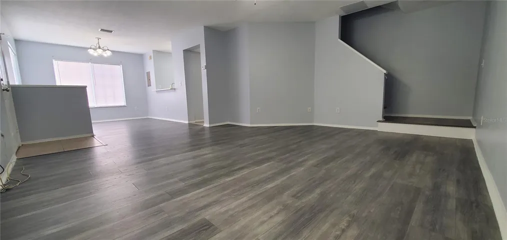 Living Room is large enough to fit a large sectional sofa.