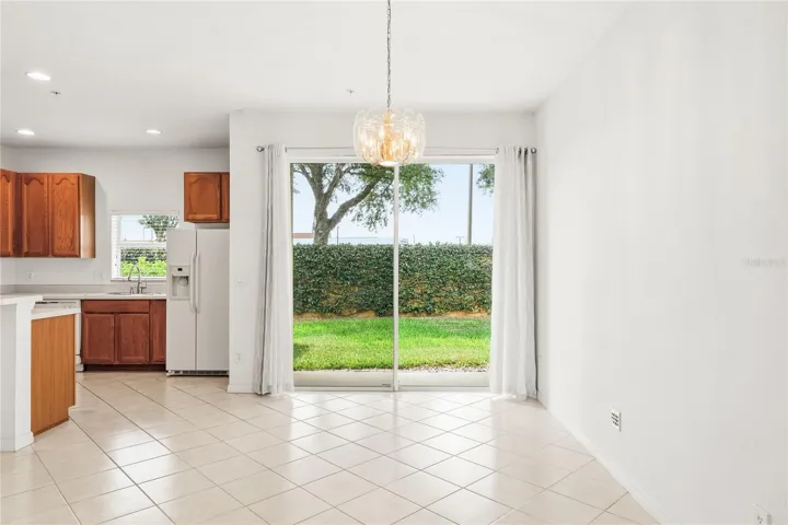 Line of sight from the foyer through the Great room into the dining and kitchen areas.