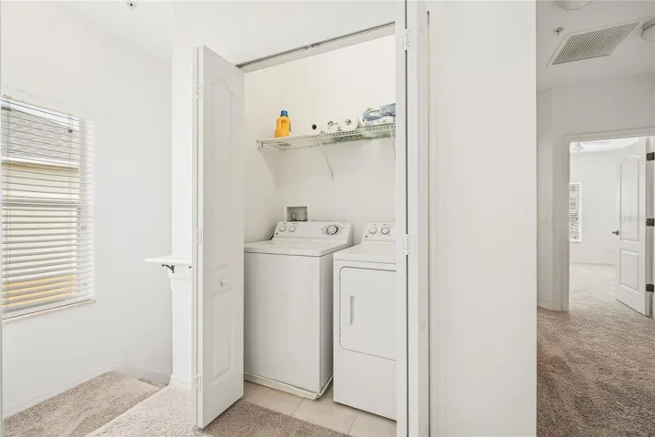 Utility closet with washer and dryer and large linen closet complete the upstairs.