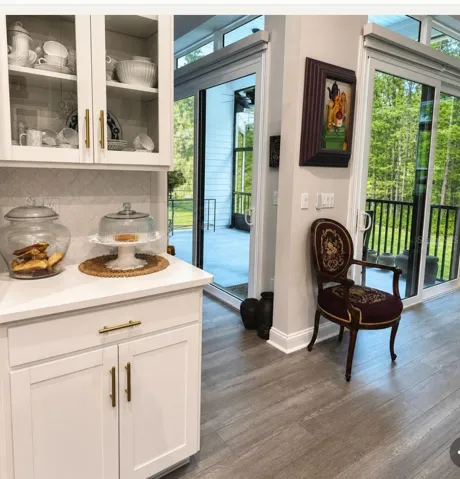 Look at the details, alcoves for whatever you want. And look at the outside with triple sliders and double on Great room side.