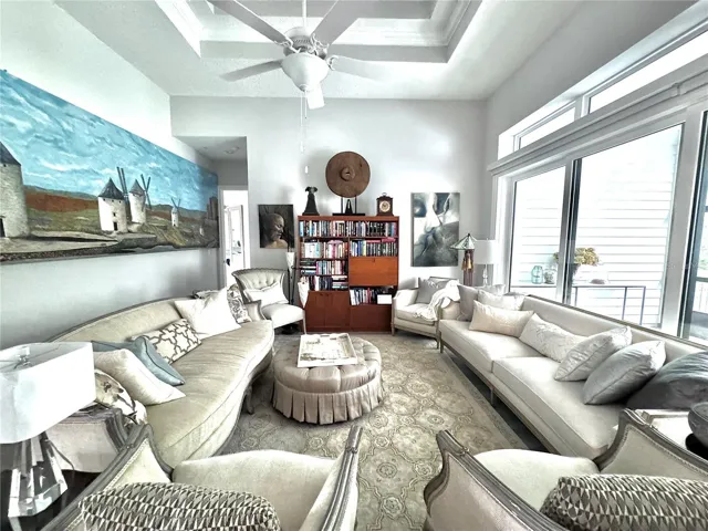 Living room with triple sliders that open to the Lanai for outdoor living.
