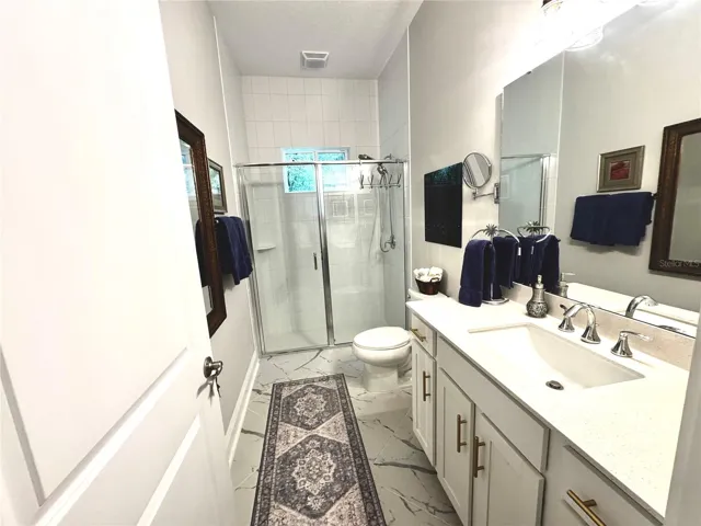 Hall bathroom next to bedroom 2 and gathering room.