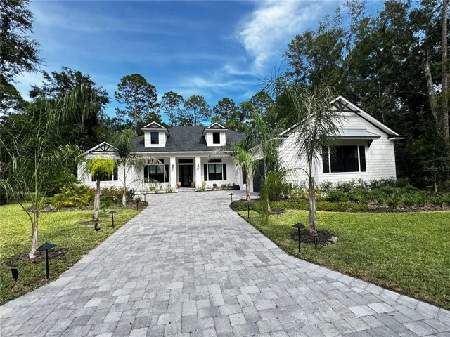 long driveway with tons of curb appeal