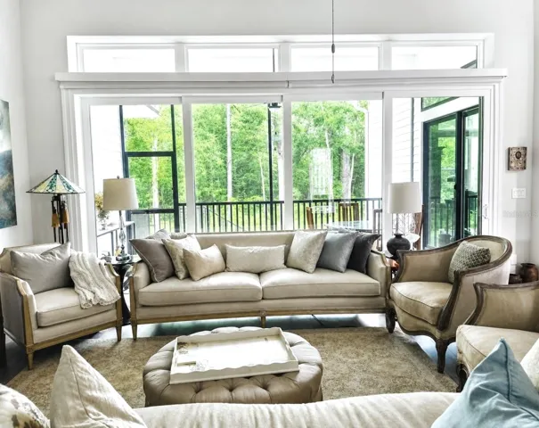 living room doors open to lanai for outside inside living.