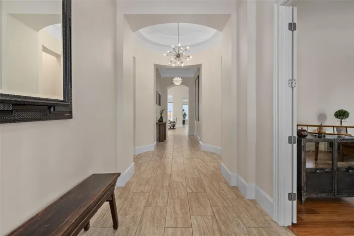 Through the double door entry to the foyer.