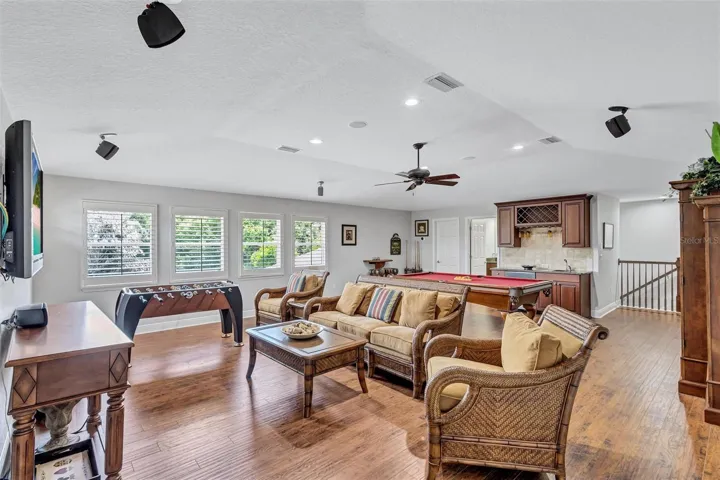 Expansive bonus room with wet bar and full bathroom