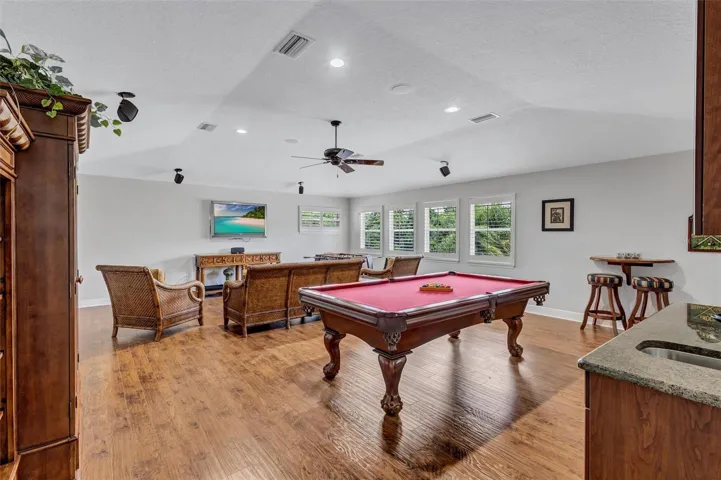 Expansive bonus room with wet bar and full bathroom