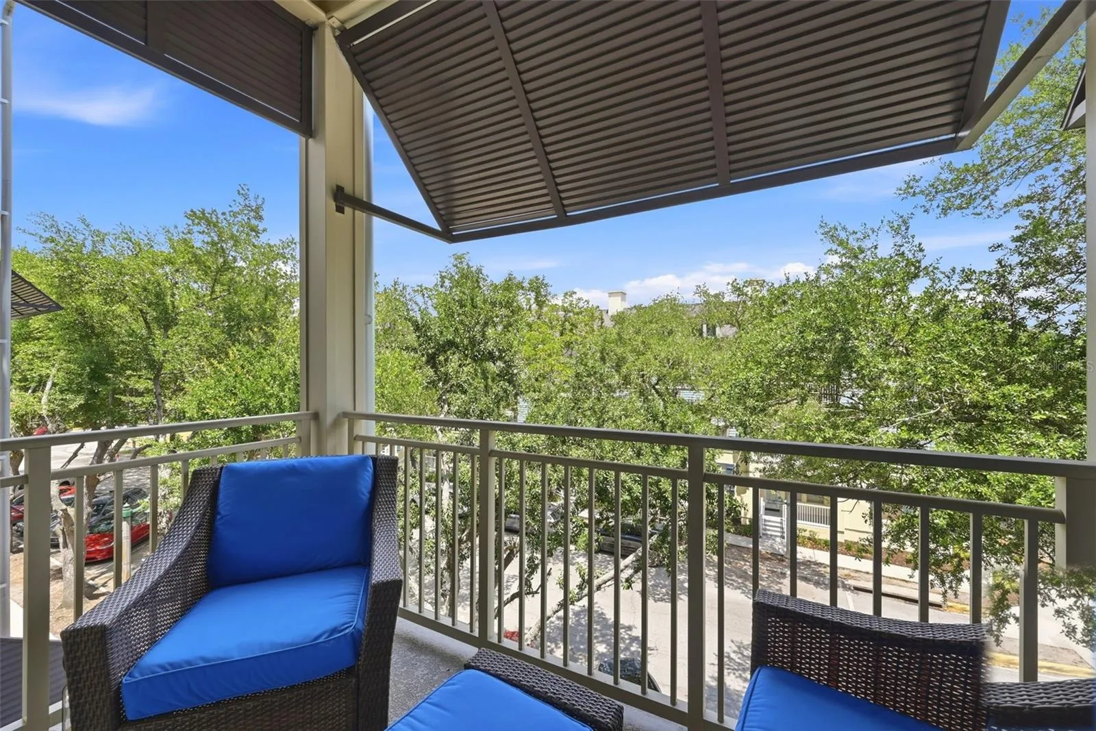 Balcony off Living Room with ceiling fan and coach light