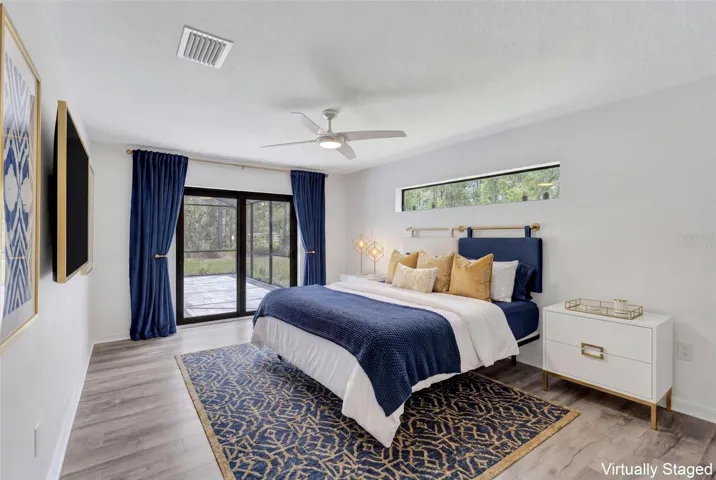 Primary Bedroom with Sliding Door Pool Access - Virtually Staged