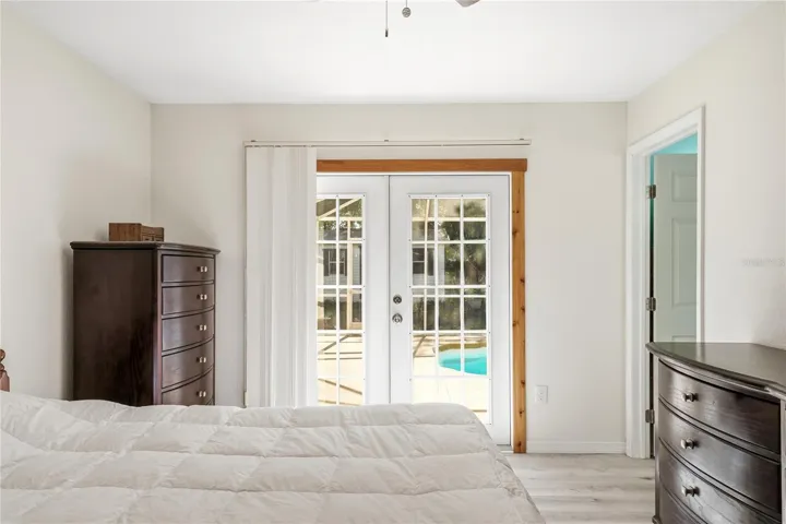 Primary bedroom with French doors to pool!