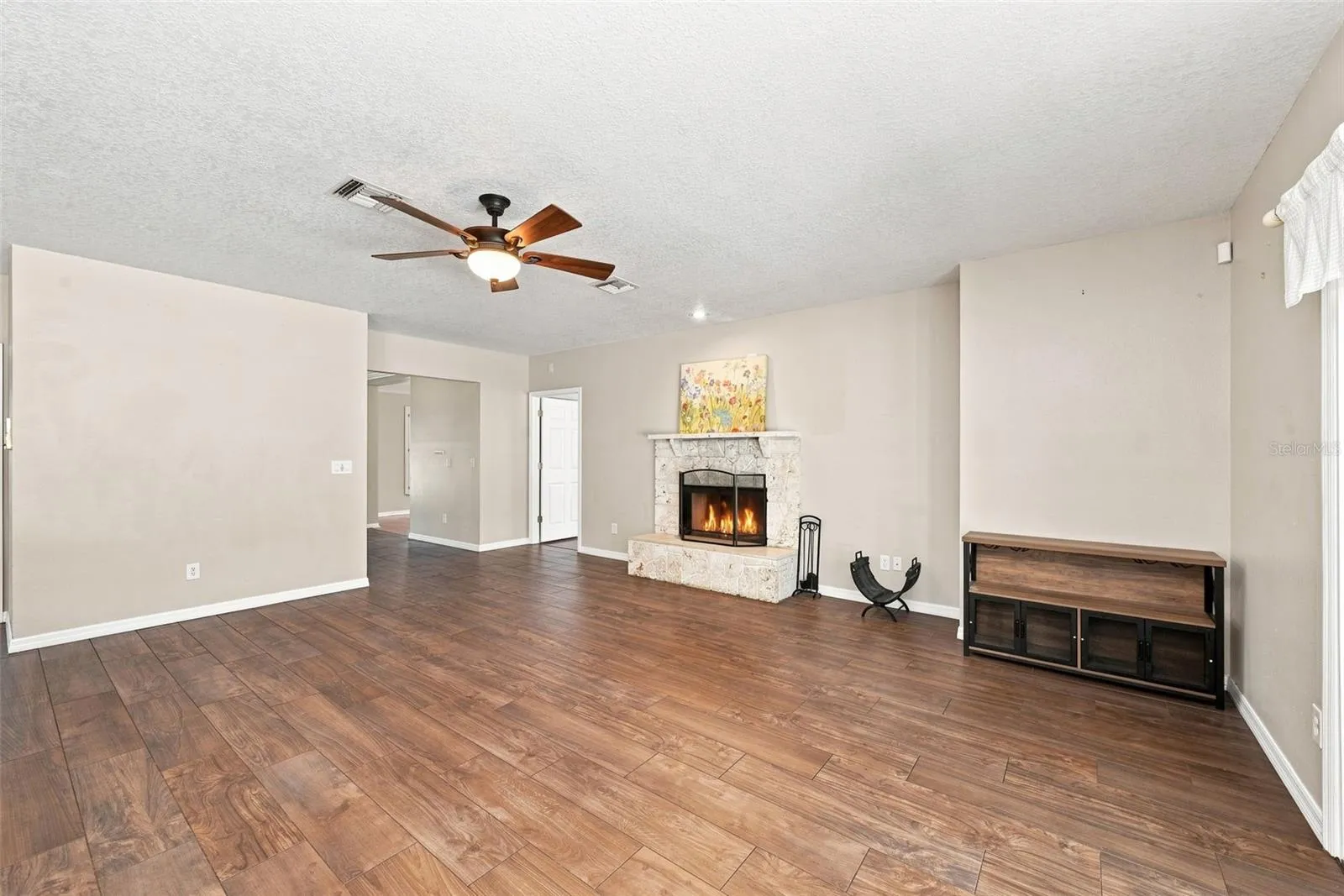 Family room + wood burning fireplace