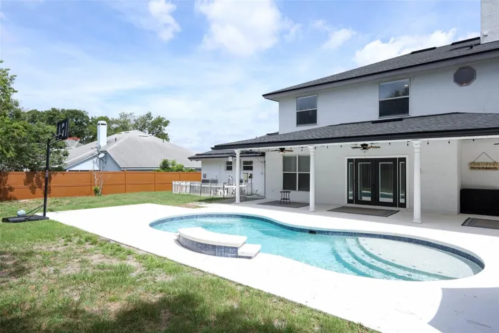 Saltwater Solar Heated Pool with Tanning Shelf and water feature