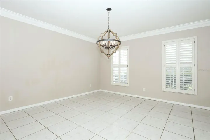 Dining Room with Plantation Shutters + Crown Moulding