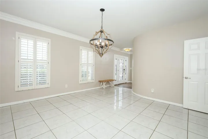 Dining Room with Plantation Shutters + Crown Moulding