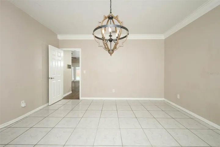 Dining Room with Plantation Shutters + Crown Moulding