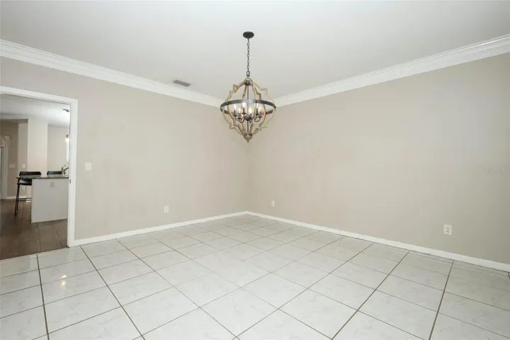Dining Room with Plantation Shutters + Crown Moulding