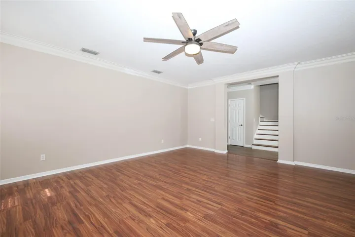 Living Room with Plantation Shutters + Crown Moulding