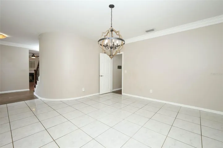 Dining Room with Plantation Shutters + Crown Moulding