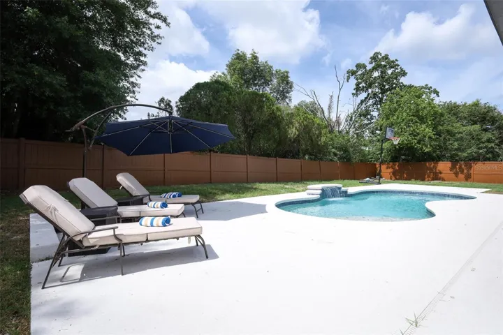 Saltwater Solar Heated Pool with Tanning Shelf and water feature
