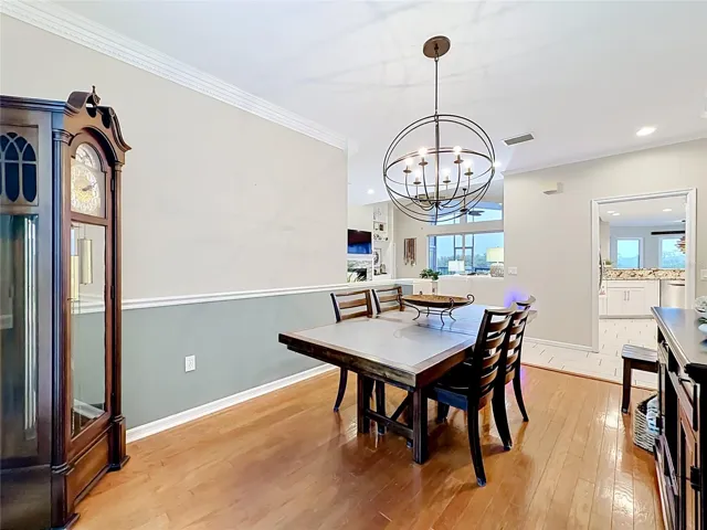 Bright and airy dining room flooded with natural sunlight, ideally situated between the great room and kitchen.