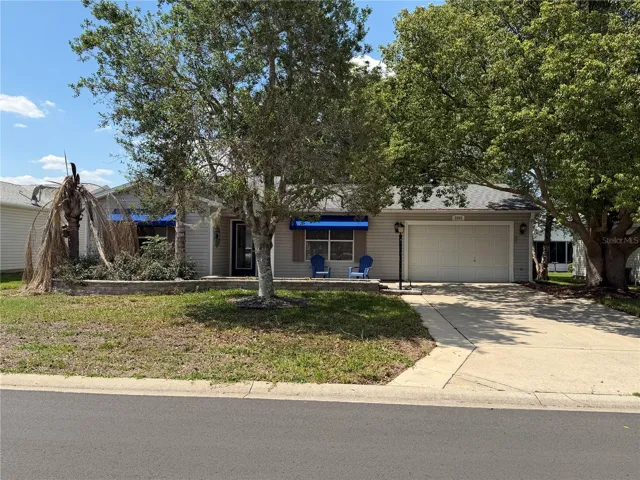 Front exterior of the Austin model in the Village of Santo Domingo with extended driveway and one-car plus golf cart garage.