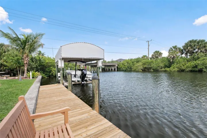 Private Dock with Covered Boat Lift and Gulf Access.