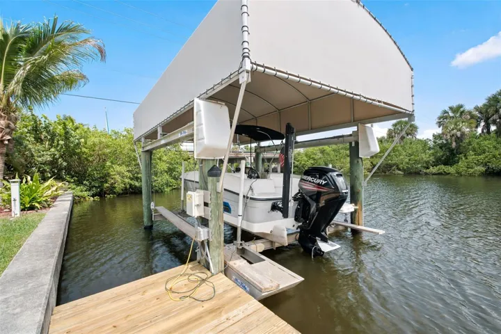 Private Dock with Covered Boat Lift and Gulf Access.