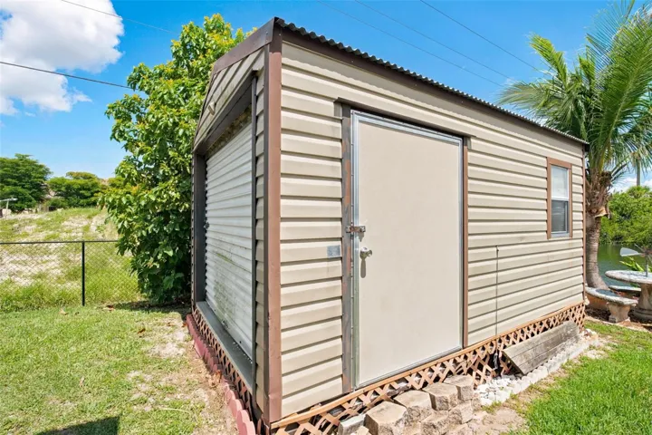 Storage Shed with Bay Door and Side Entrance