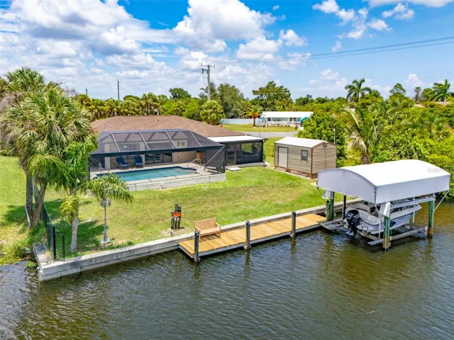 Prime Waterfront Living with Private Dock and Covered Boat Lift.
