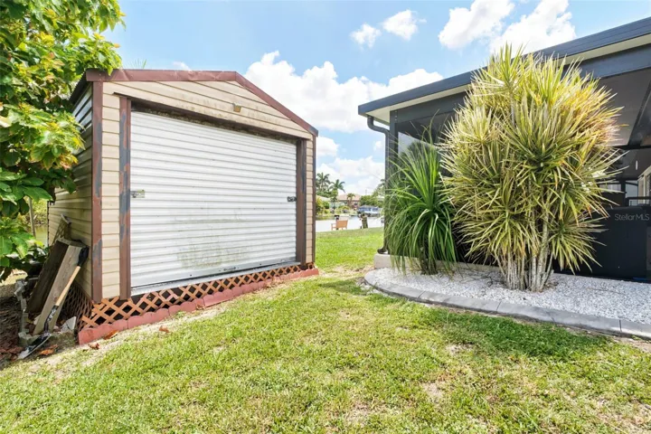 Storage Shed with Bay Door and Side Entrance